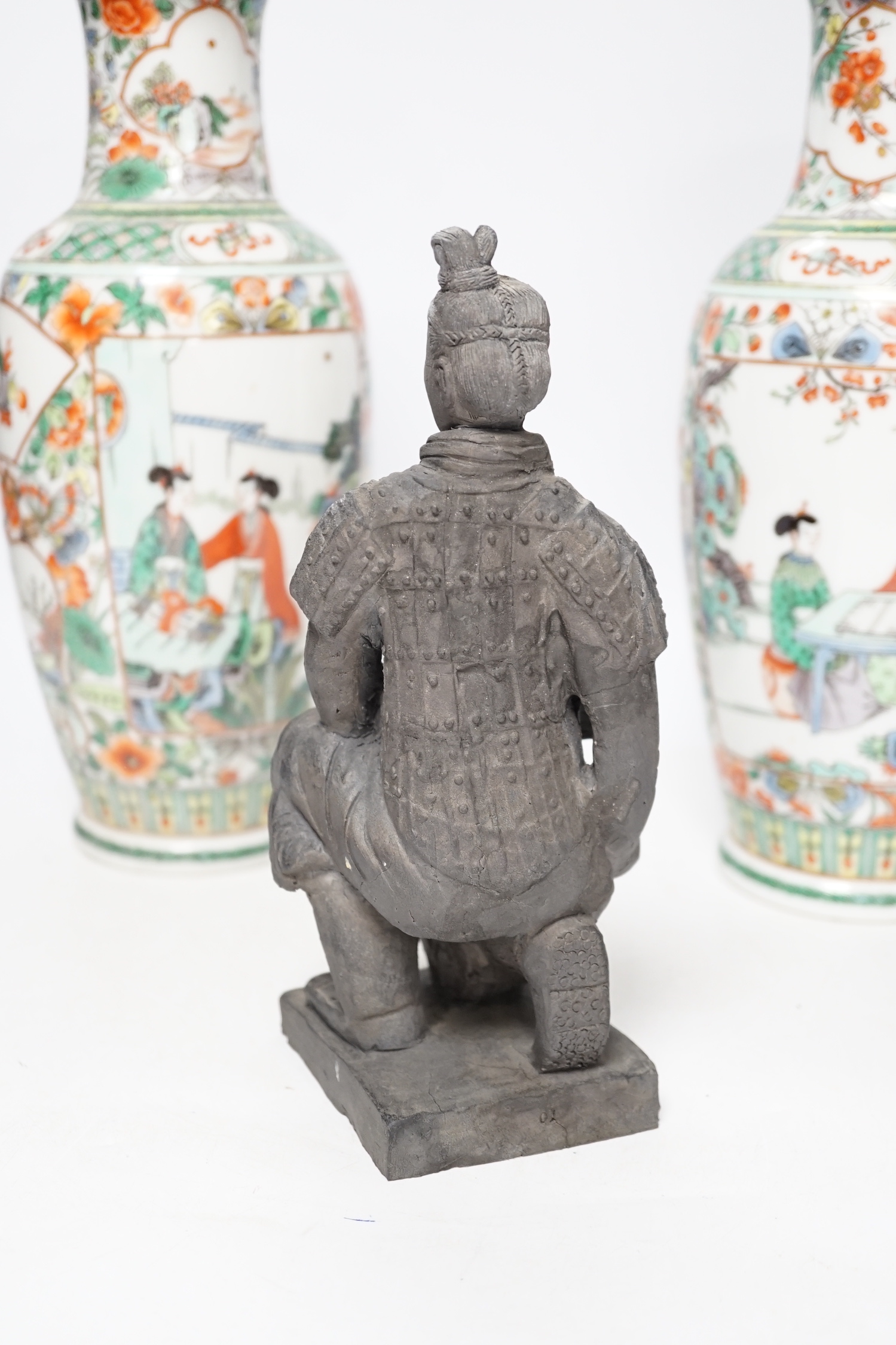 A pair of 20th century Chinese famille verte vases and a figure, tallest 31cm